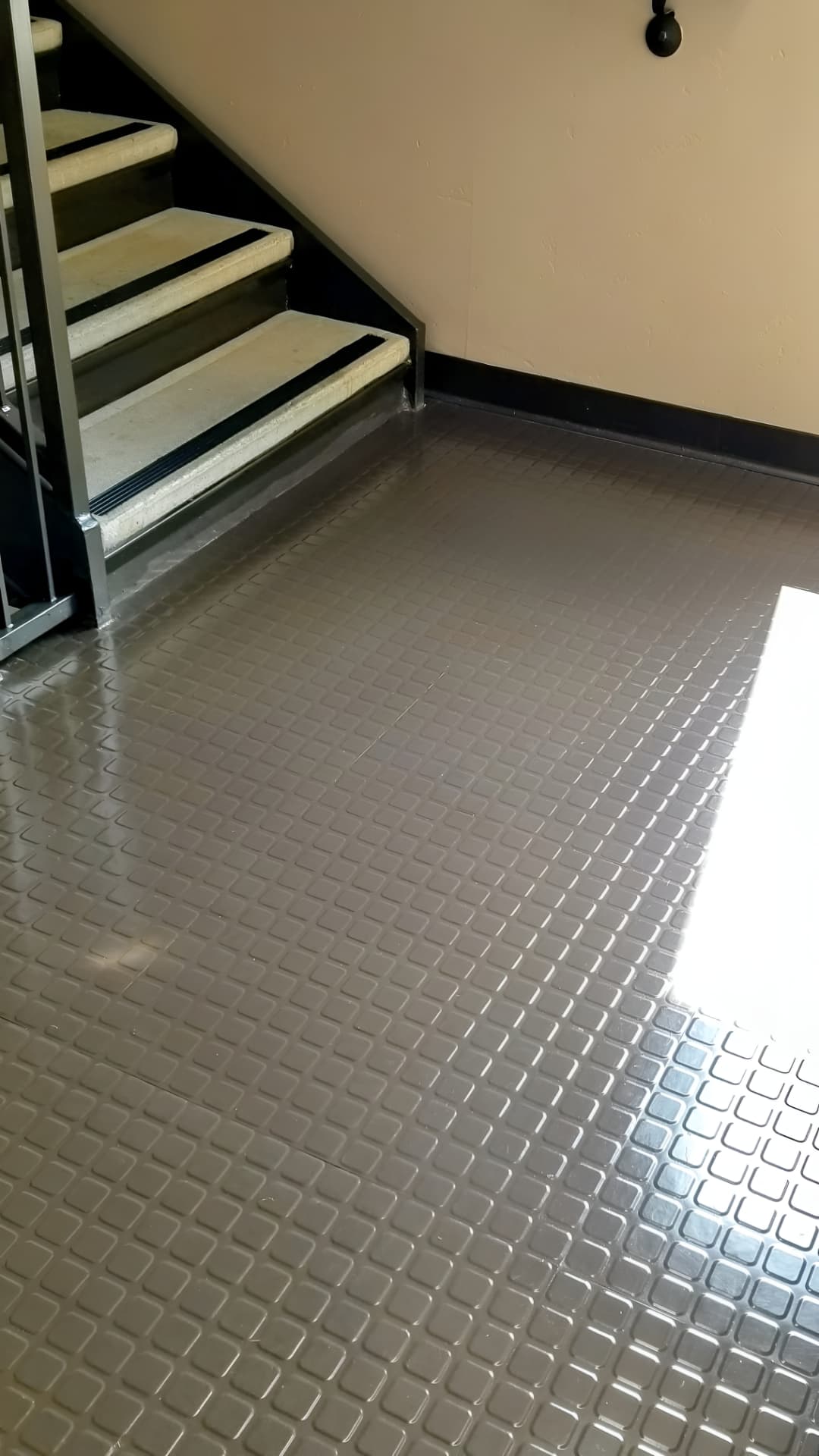 Polished commercial concrete stairwell flooring cleaned by G&J Cleaning Services